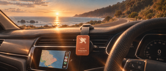 Littos Coffee Chews in a car on a coastal road at sunset, with a route map on the dashboard