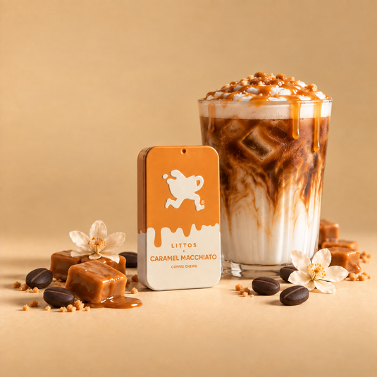 Littos Caramel Macchiato Coffee Chews tin beside an iced caramel macchiato and caramels